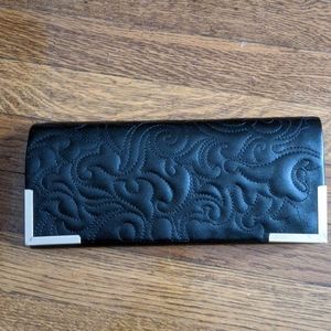 Black clutch with gold accents